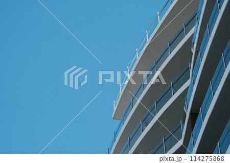 modern business office building against blue sky 114275868
