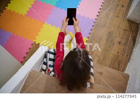 View from above of kid's hands holding smart...の写真素材 [114277845] - PIXTA