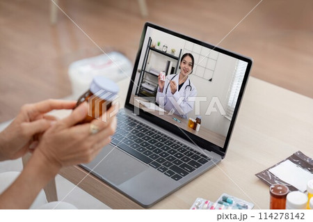 Elderly woman sit at home having online consultation with doctor on computer laptop, sick senior talk on video call consulting with nurse using laptop, healthcare concept Elderly woman sit at home having online consultation with doctor on computer laptop, sick senior talk on video call consulting with nurse using laptop, healthcare concept 114278142