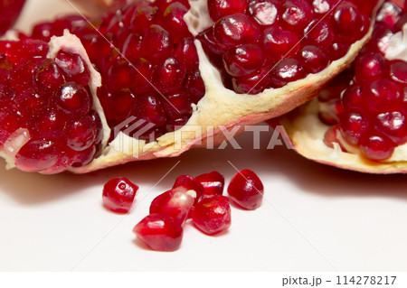Purified pomegranate fruit on a white background Purified pomegranate fruit on a white background 114278217