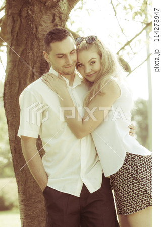 Happy couple having romantic date in park Happy couple having romantic date in park 114278947