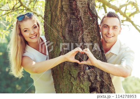 Happy couple having romantic date in park Happy couple having romantic date in park 114278953