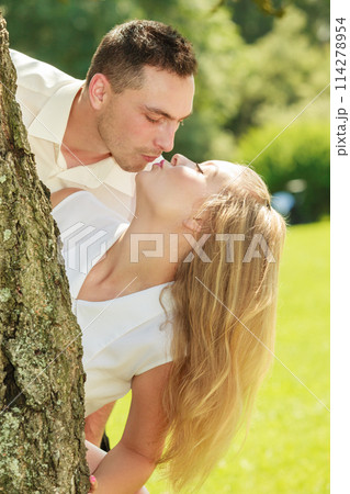 Happy couple having romantic date in park Happy couple having romantic date in park 114278954