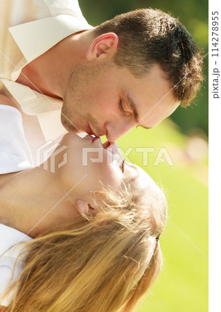Happy couple having romantic date in park Happy couple having romantic date in park 114278955