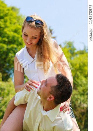 Happy couple having romantic date in park Happy couple having romantic date in park 114278977