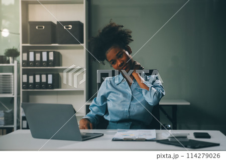 Asian woman working hard in the office having aches and pains in her torso and waist Asian woman working hard in the office having aches and pains in her torso and waist 114279026