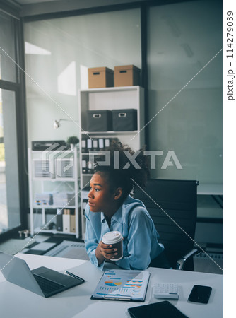 Sad tired young asian lady thinking, sleep at laptop, suffering from overwork, stress in room interior. Deadline, problems in study, work, business, freelance at home new normal with tech 114279039