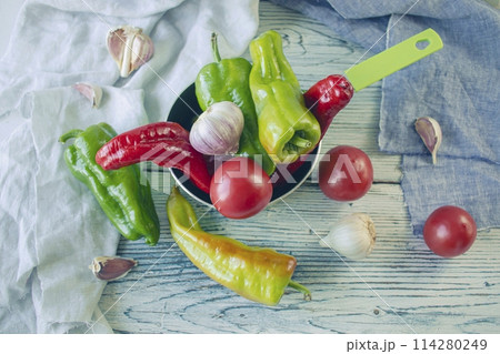 fresh ripe assorted vegetables for cooking dinner on a wooden rustic table 114280249