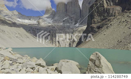 Majestic Torres del Paine Towers Over a Deep Turquoise Lake Majestic Torres del Paine Towers Over a Deep Turquoise Lake 114280749