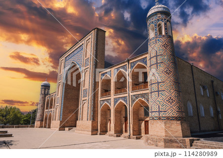 ancient Uzbek Islamic Kukeldash madrasah in Tashkent in Uzbekistan. Old madrassa in Asia on background of beautiful sunset sky 114280989