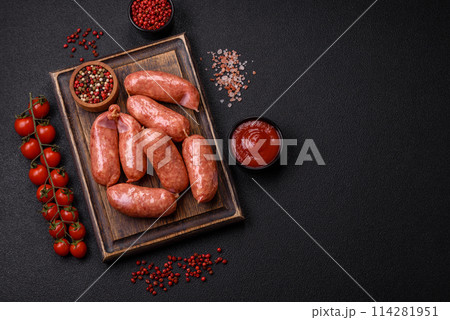 Baked chicken or pork sausages, salt, spices and herbs Baked chicken or pork sausages, salt, spices and herbs 114281951