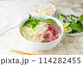 pho bo, vietnamese raw beef and rice noodle shoup 114282455