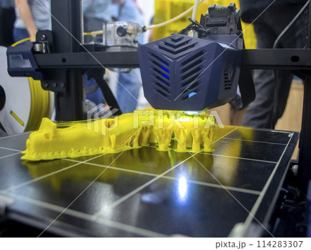 3D printer printing object close-up. Process creating three-dimensional model on 3d printer. Additive printer technology. 3D Prototyping. 3D design modeling. New modern innovation printing technology 3D printer printing object close-up. Process creating three-dimensional model on 3d printer. Additive printer technology. 3D Prototyping. 3D design modeling. New modern innovation printing technology 114283307