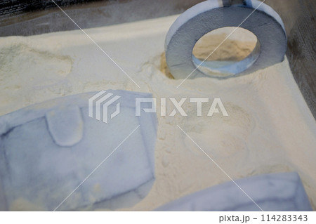 White polyamide powder and object on 3D printed from white polyamide powder close-up. Polyamide powder for creating objects on 3D printer. Additive MJF Multi Jet Fusion technologies. Thermoplastic 114283343