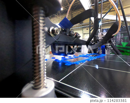 Abstract object printing on 3D printer with molten plastic close-up. 3D printer printing model melted plastic. 3D Prototyping. 3D design. Additive printer technology. New modern printing technology 114283381