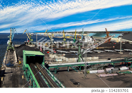Maritime Bulk Terminal of Sea trade port with coal harbor and liquid cargo complex behind. Maritime Bulk Terminal of Sea trade port with coal harbor and liquid cargo complex behind. 114283701