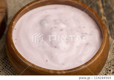 delicious ripe blackberries and yogurt made from milk 114284503