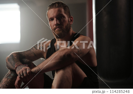 Bearded man in sportswear having rest Bearded man in sportswear having rest 114285248