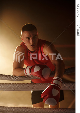 Young boxer having break between rounds Young boxer having break between rounds 114285349