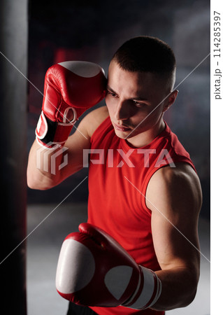Young boxer preparing for competition 114285397