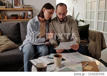 Troubled couple with financial bill Troubled couple with financial bill 114285540
