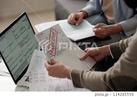 Taking out bill while checking post Taking out bill while checking post 114285559