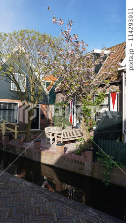 Beautiful wooden houses. Typical small Dutch houses facades in Volendam, Netherlands Beautiful wooden houses. Typical small Dutch houses facades in Volendam, Netherlands 114293911