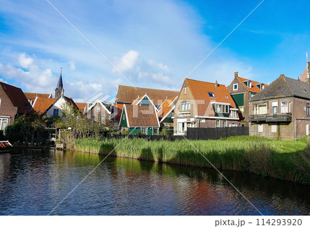 Beautiful wooden houses. Typical small Dutch houses facades in Volendam, Netherlands 114293920