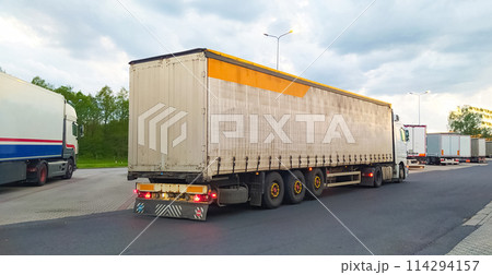 Trucks at parking lot. Delivery Trucks. Cargo Shipping. Lorry. Industry Freight Truck Logistics Cargo Transport Concept. 114294157