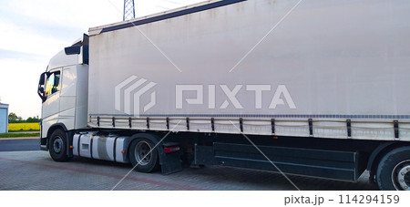 Trucks at parking lot. Delivery Trucks. Cargo Shipping. Lorry. Industry Freight Truck Logistics Cargo Transport Concept. 114294159