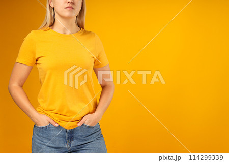 A young woman in a yellow T-shirt A young woman in a yellow T-shirt 114299339
