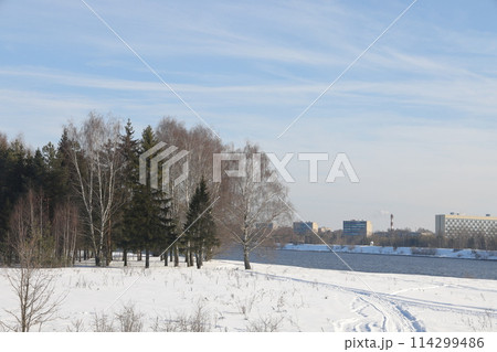 river on a sunny evening. Trees and shrubs. Landscape of winter nature, river banks river on a sunny evening. Trees and shrubs. Landscape of winter nature, river banks 114299486