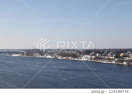 river on a sunny evening. Trees and shrubs. Landscape of winter nature, river banks  river on a sunny evening. Trees and shrubs. Landscape of winter nature, river banks  114299734