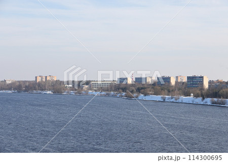 river on a sunny evening. Trees and shrubs. Landscape of winter nature, river banks  114300695