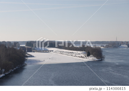 river on a sunny evening. Trees and shrubs. Landscape of winter nature, river banks  114300815