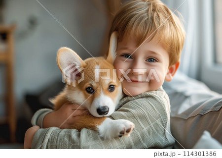 AI-generated item. Cute little boy with welsh corgi puppy at home.	 114301386