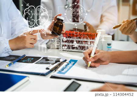 Doctor team, analysis the blood test examination results and medication usage of the patient on the chart, medical check-up concept. Doctor team, analysis the blood test examination results and medication usage of the patient on the chart, medical check-up concept. 114304452