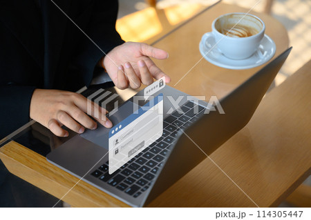 Hands typing username and password to access the system. Cybersecurity concept 114305447