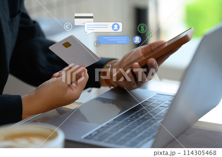 Businessman holding credit card making payment digital transaction paying online on smartphone Businessman holding credit card making payment digital transaction paying online on smartphone 114305468