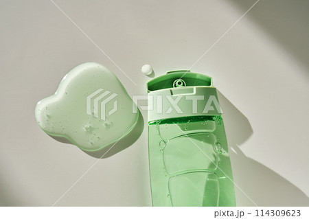 Shower gel or shampoo on a white background with sun light. 114309623