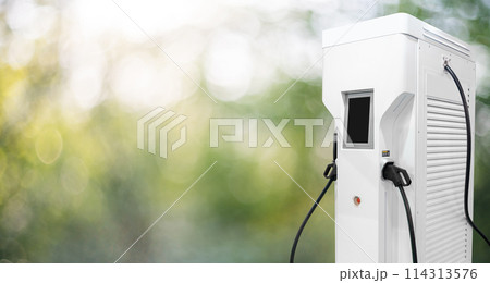 Electric car charging station on a green background Electric car charging station on a green background 114313576