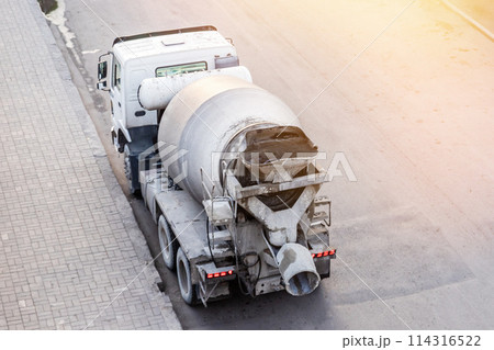 A concrete mixer truck stands on the road waiting in line to unload concrete, From Above view. 114316522