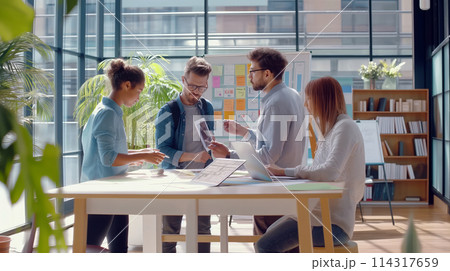 Group of People Standing Around Table 114317659