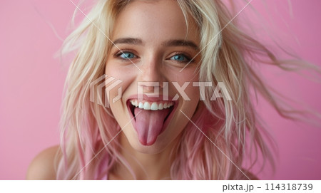 Woman Wearing Sunglasses Standing in Front of Wall 114318739