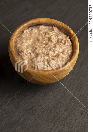 canned fish from finely chopped stewed tuna fillet canned fish from finely chopped stewed tuna fillet 114320737