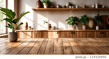 A plant on a wooden table. 114320950