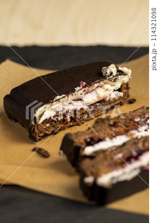 cottage cheese dessert with cherry jam covered with chocolate cottage cheese dessert with cherry jam covered with chocolate 114321098