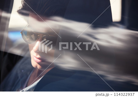 Travel, man in car in window and journey for adventure with transport and view. Road trip, thinking and male person with windshield on drive, vacation or commute in style or relax on backseat. Travel, man in car in window and journey for adventure with transport and view. Road trip, thinking and male person with windshield on drive, vacation or commute in style or relax on backseat. 114322937