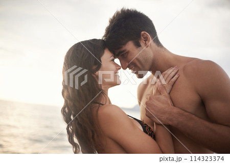 Love, happy couple and sunset at ocean for holiday, vacation or travel together in summer on mockup. Man, woman and romance at sea for connection, care and touch face on adventure by water outdoor 114323374