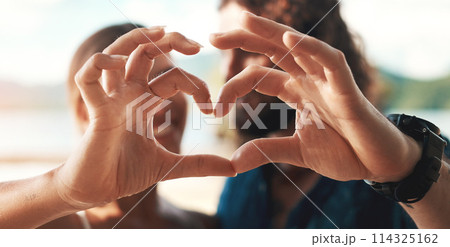 Couple, hands and heart with smile, happy and love for together, bonding and romance in outdoor. Woman, man and shape for honeymoon, vacation or holiday in summer for weekend, getaway and adventure Couple, hands and heart with smile, happy and love for together, bonding and romance in outdoor. Woman, man and shape for honeymoon, vacation or holiday in summer for weekend, getaway and adventure 114325162